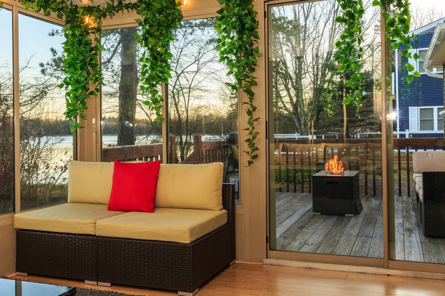 Another angle of the sunroom that shows access to the outdoor deck area.